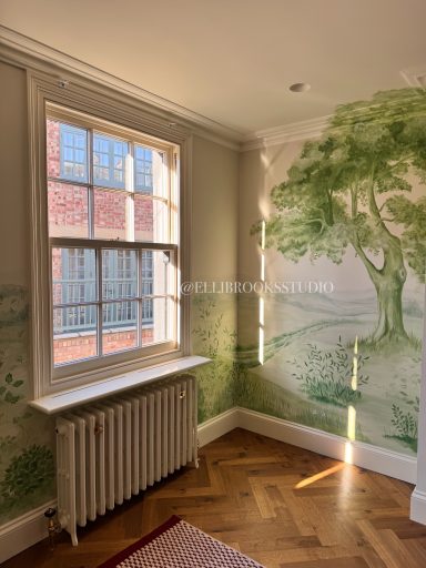 Detailed close-up of toile-style hand-painted English oak with fine foliage on tonal green mural.