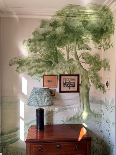 Detailed close-up of toile-style hand-painted English oak with fine foliage on tonal green mural.