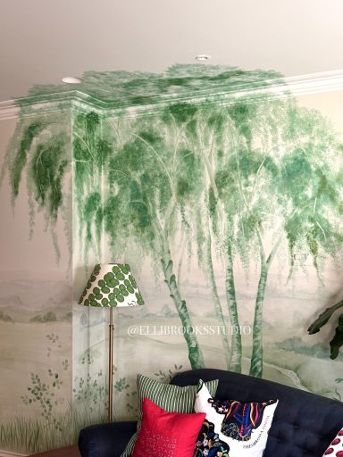 Silver birch tree branches hand-painted onto wall and ceiling as part of bespoke tonal green scenic mural